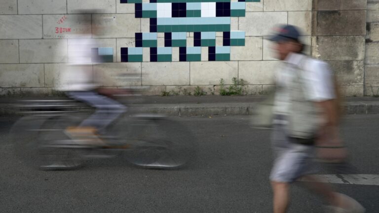 Mystery Paris street artist ‘Invader’ glues up new work to celebrate Olympics and delight fans